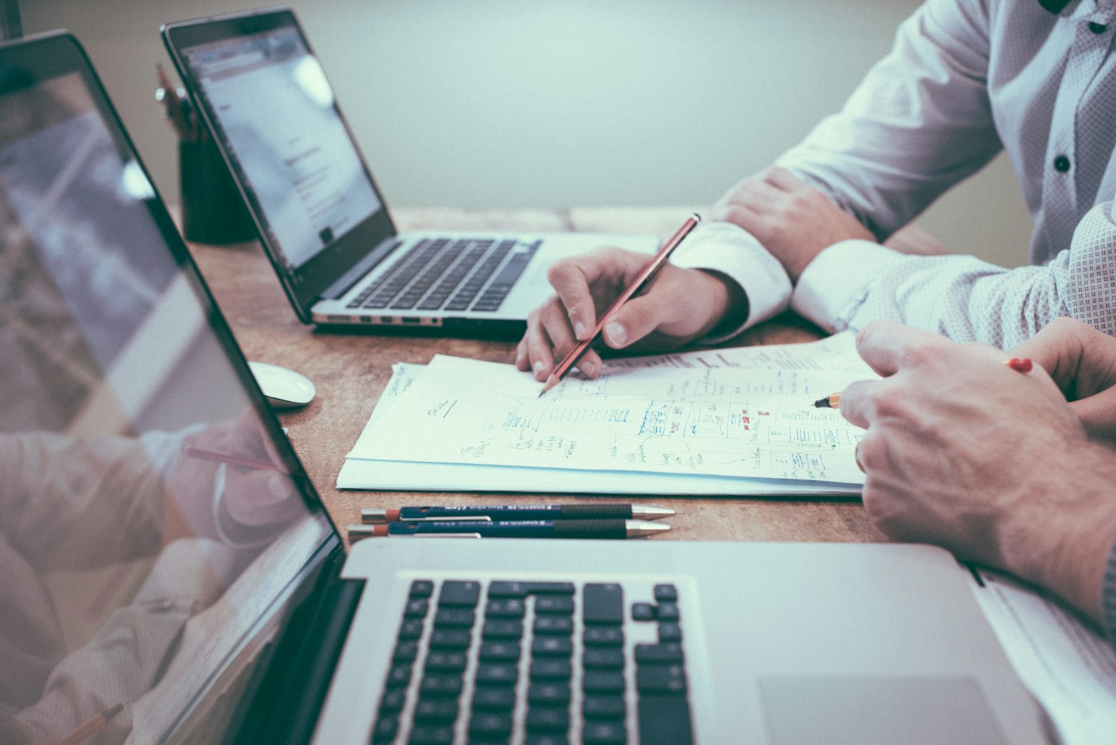 Advisor reviewing an application file at a desk