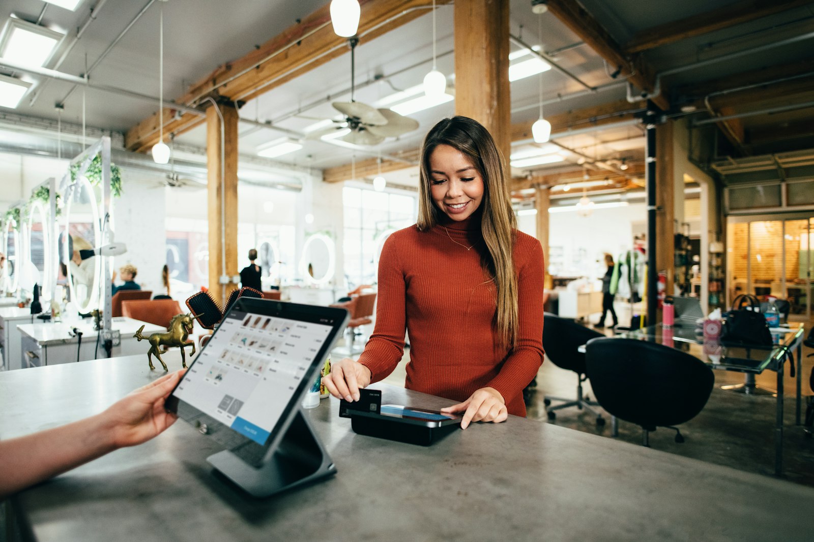 Small business owner at the counter of her shop